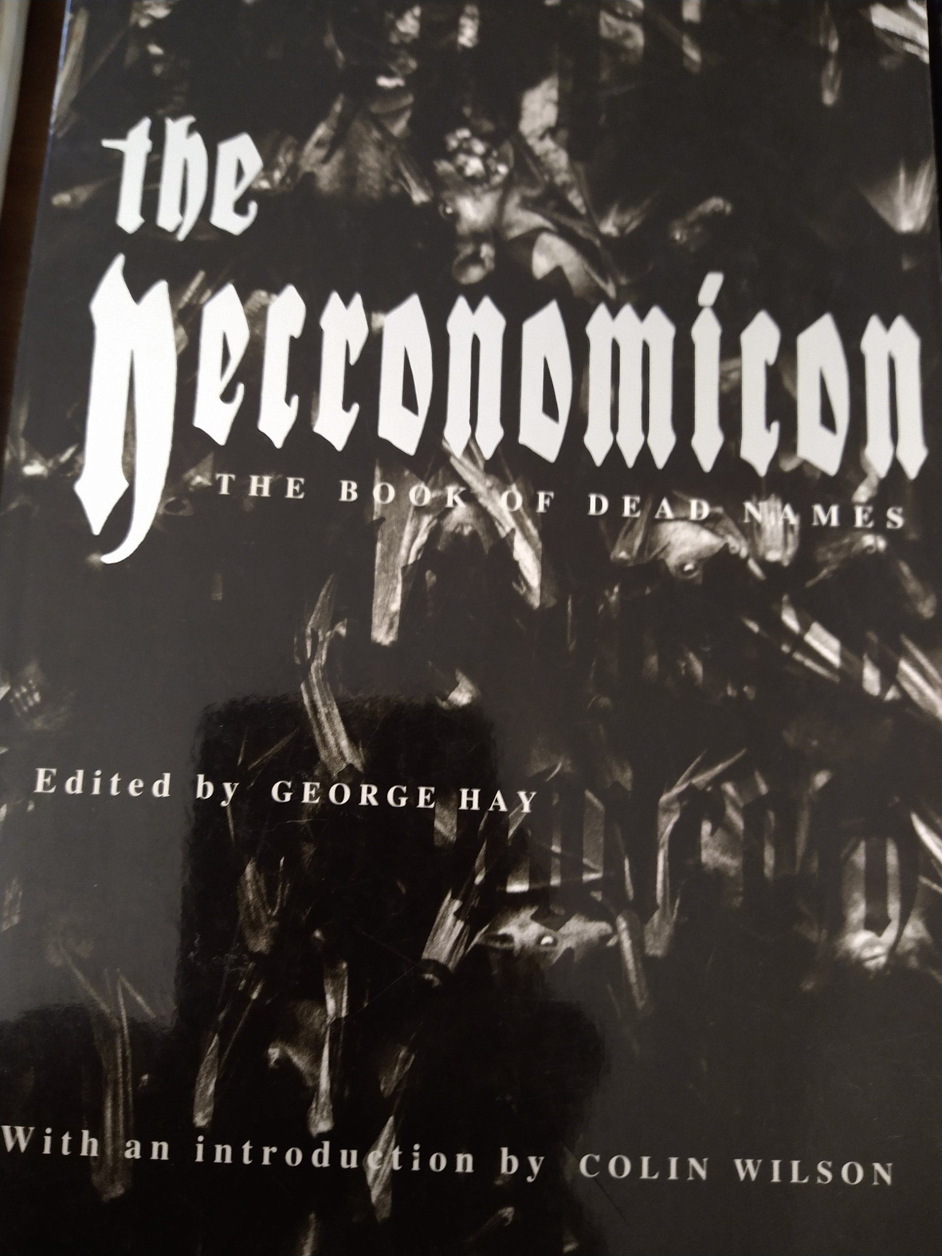 A black and white book titled the necronomicon