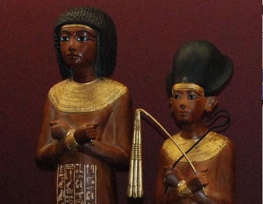 A statue of a man and a woman standing next to each other