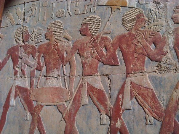 A painting of a group of men on a wall