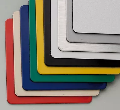 A bunch of different colored sheets of paper are stacked on top of each other.