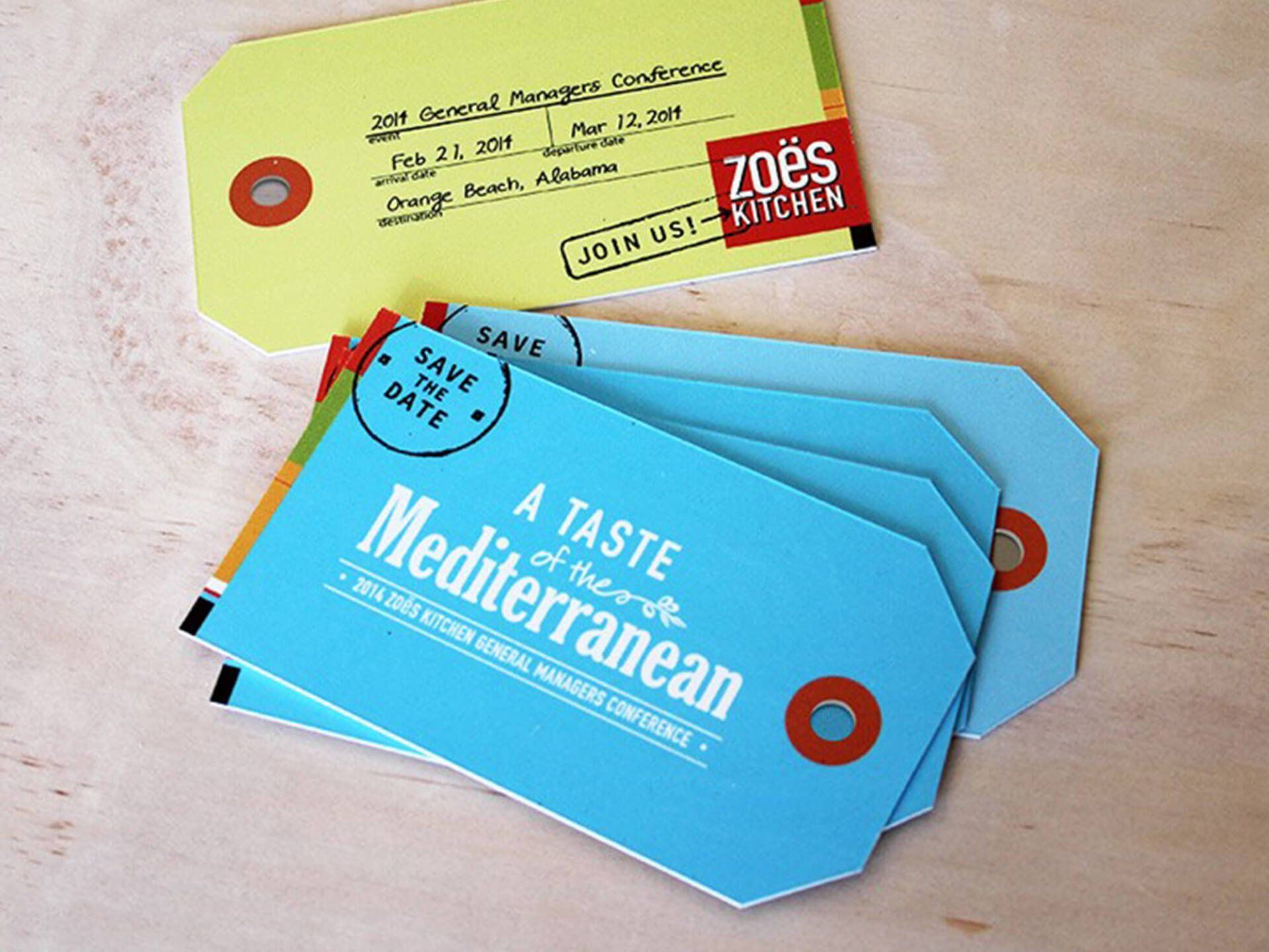 A stack of blue and yellow tags that say a taste of the mediterranean