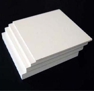 A stack of white sheets of paper sitting on top of each other on a black surface.