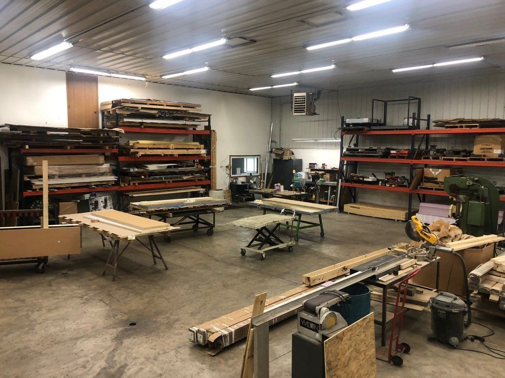 A large room filled with wooden tables and shelves.