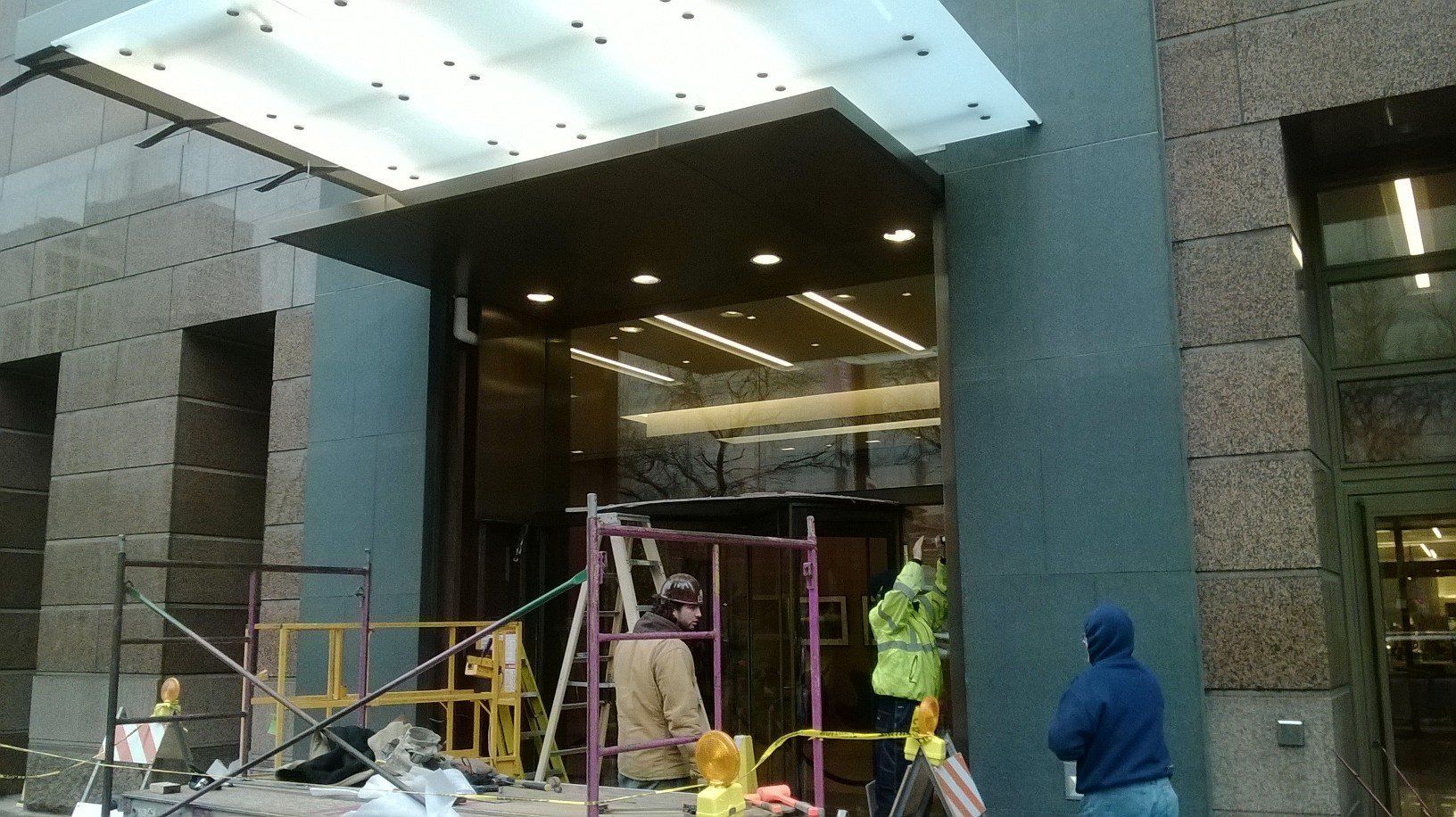 A group of construction workers are working on a building