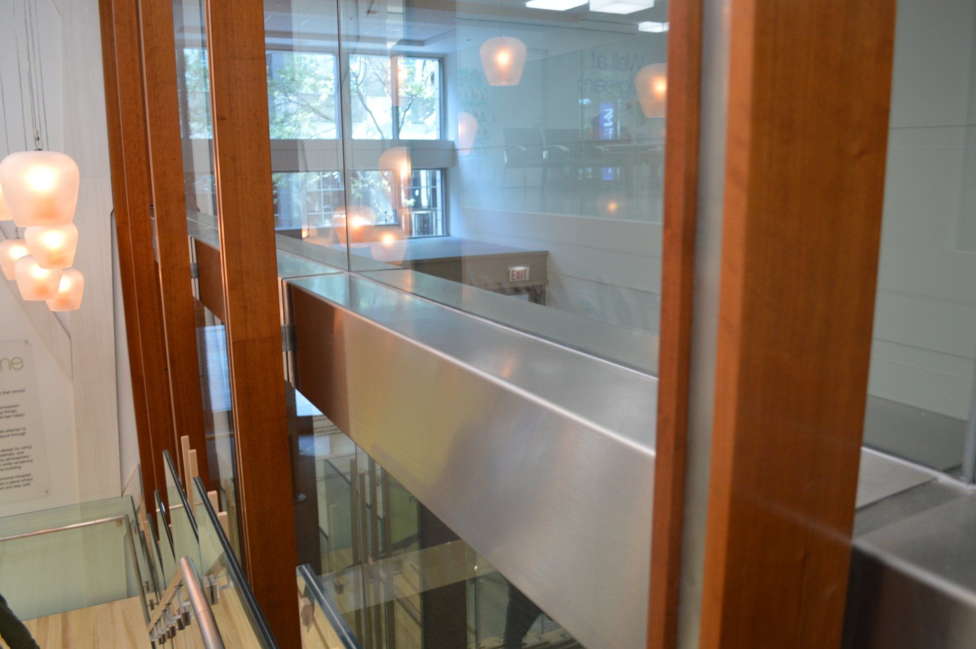 A view of a staircase from the second floor of a building.