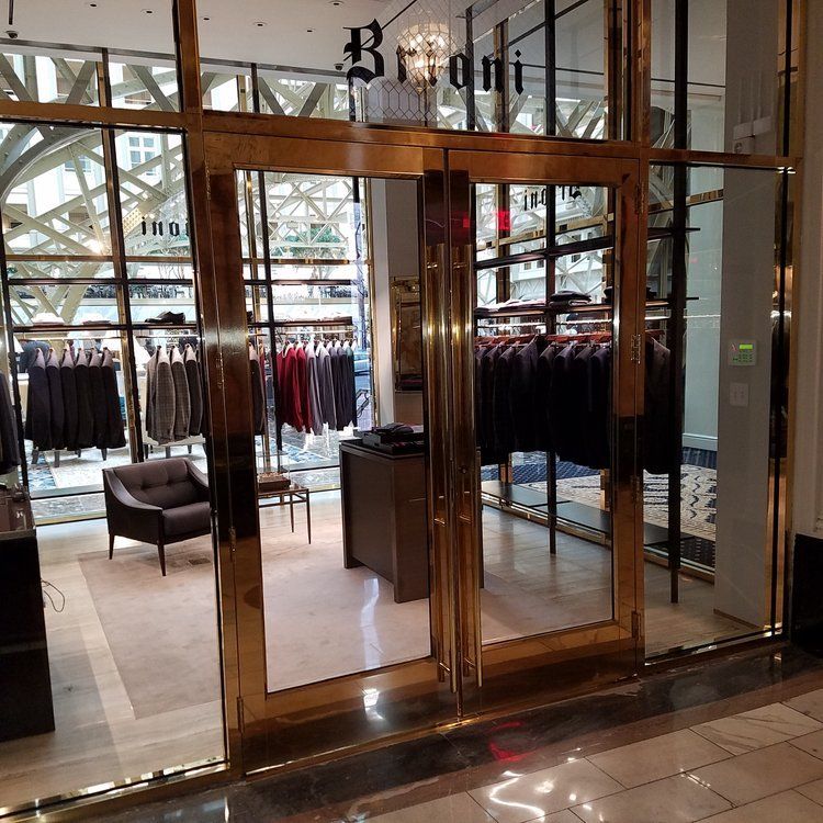 A store front with a sign that says ' brioni ' on it