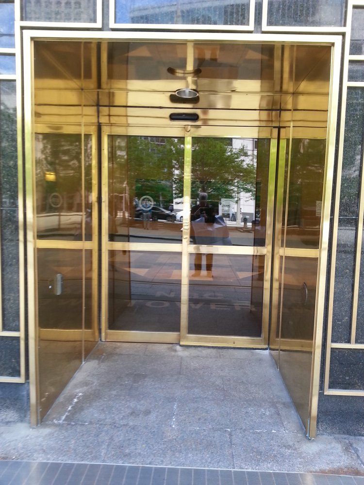 A sliding glass door is open to a building