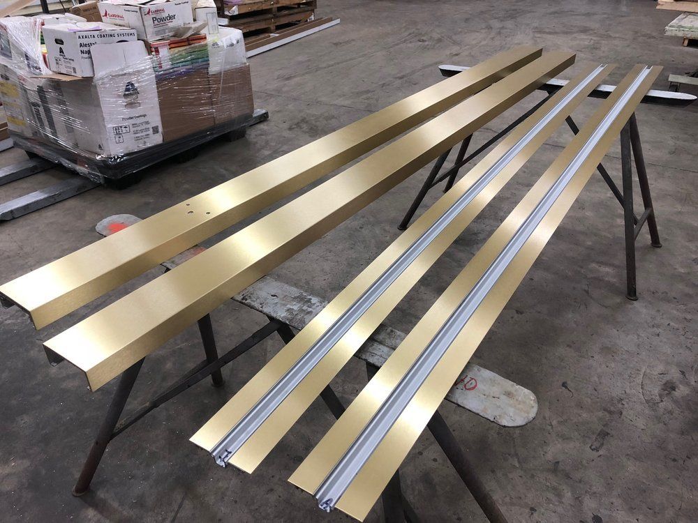 A bunch of metal pieces are sitting on a table