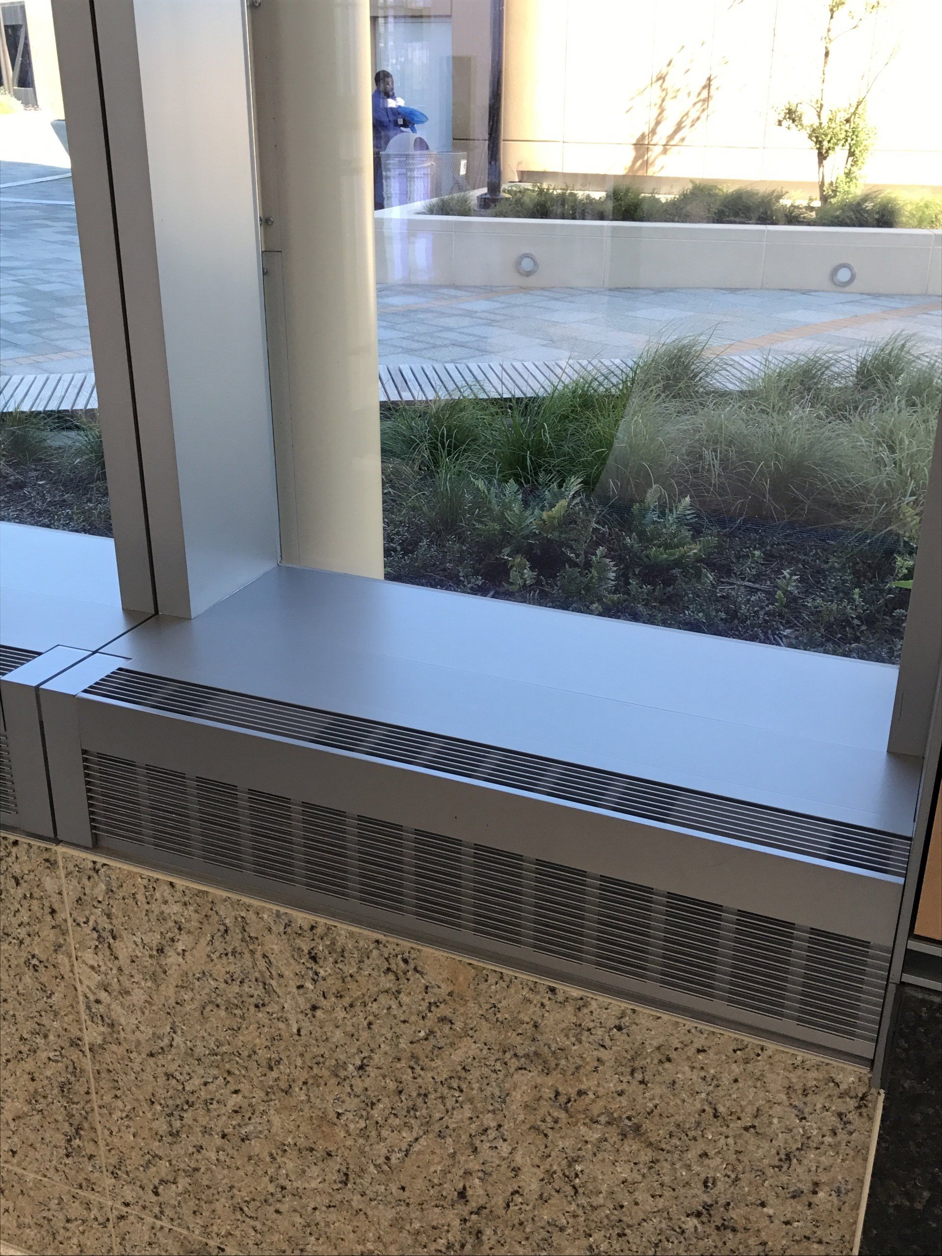 A window with a heater on the side of it