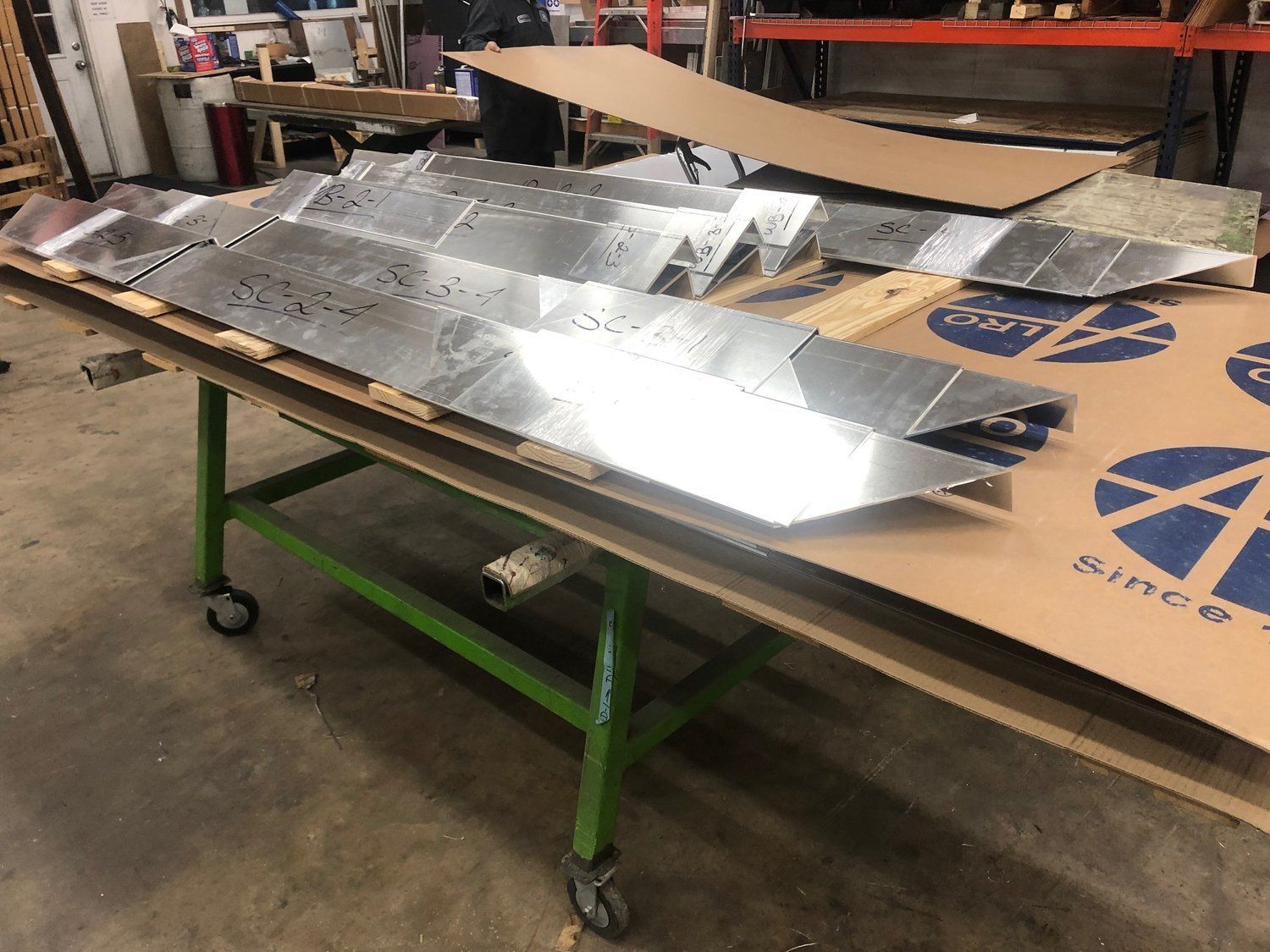 A table with a lot of metal pieces on it.