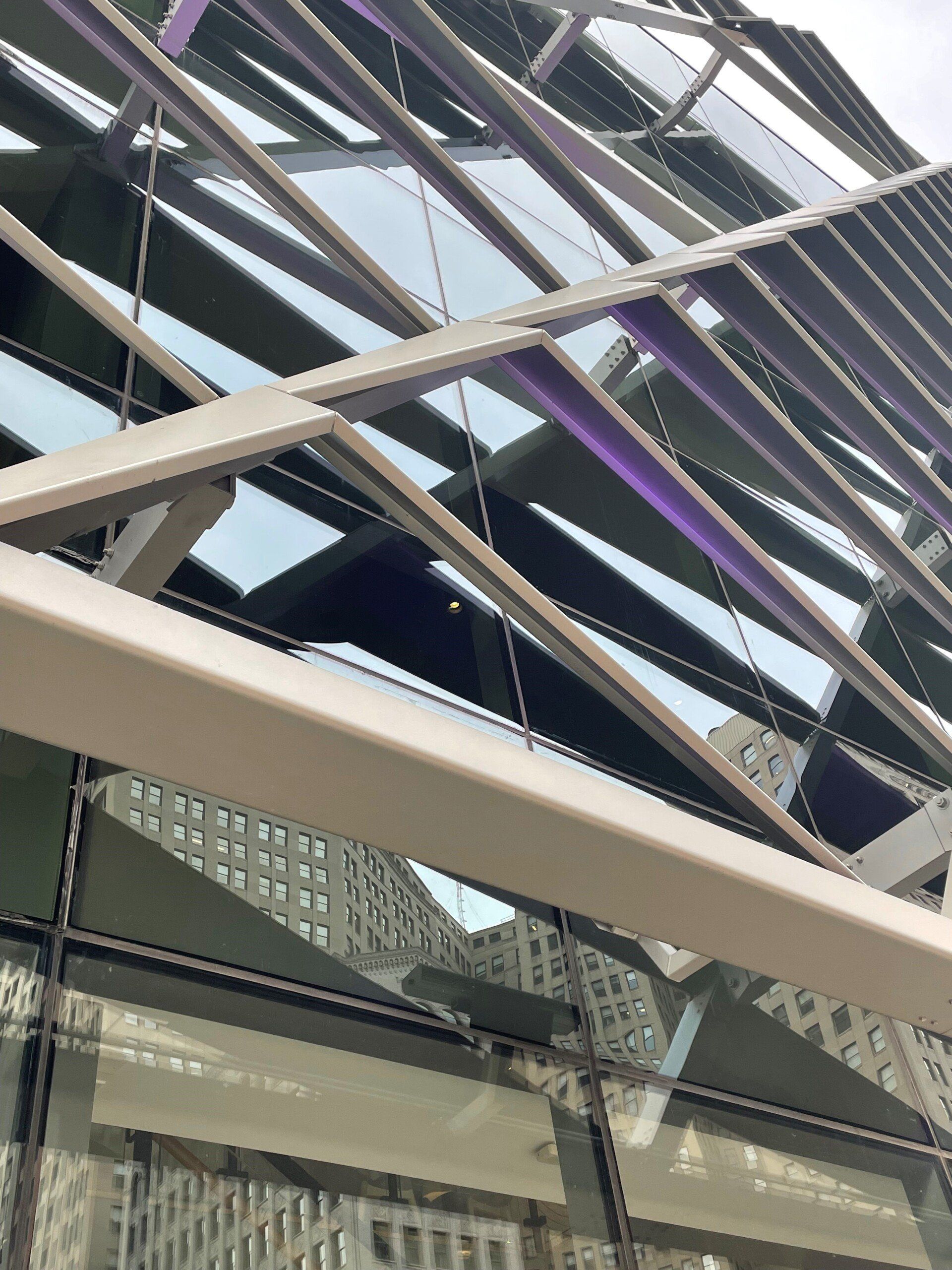 Looking up at the roof of a building with a lot of windows