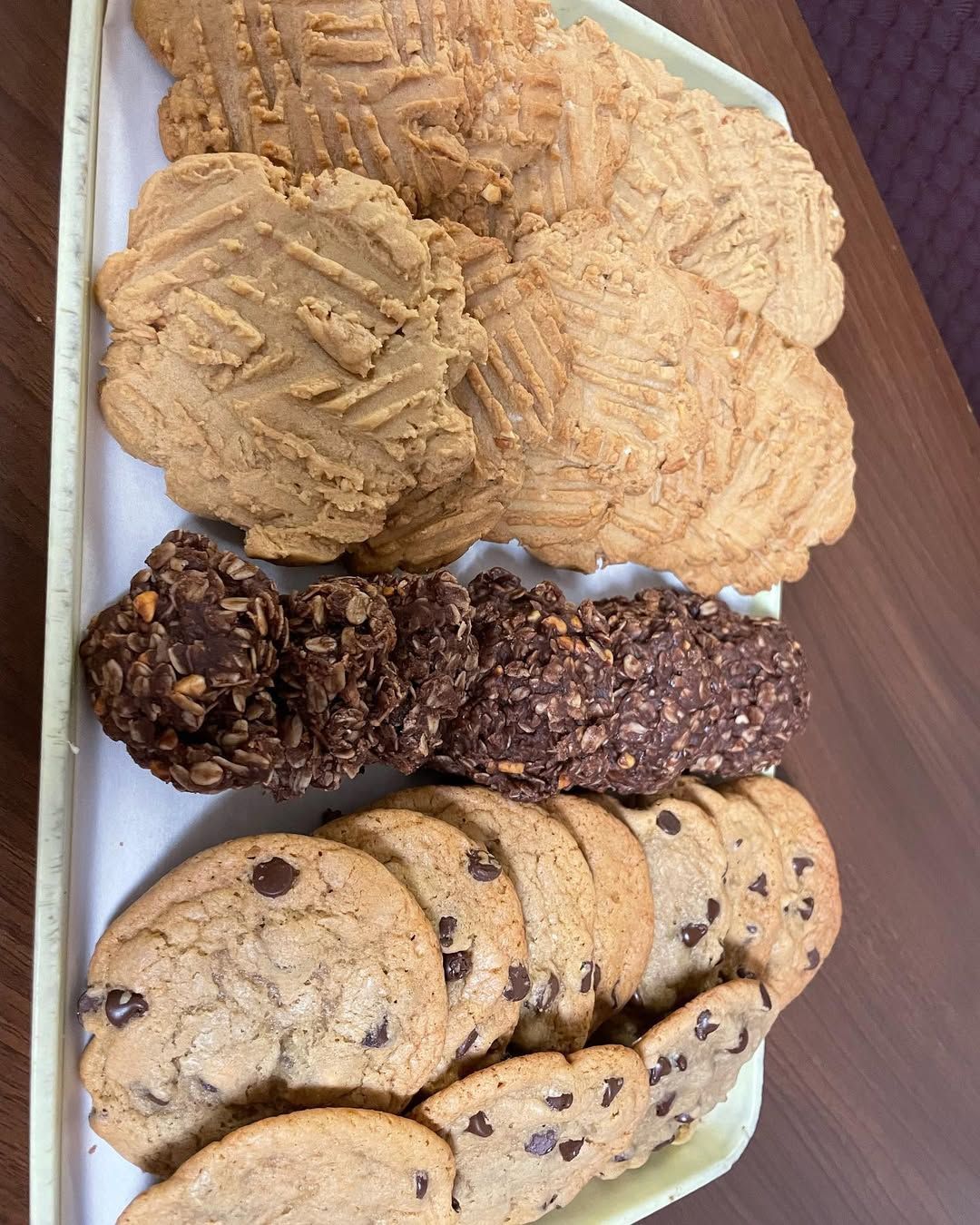 A tray of different types of cookies on a table