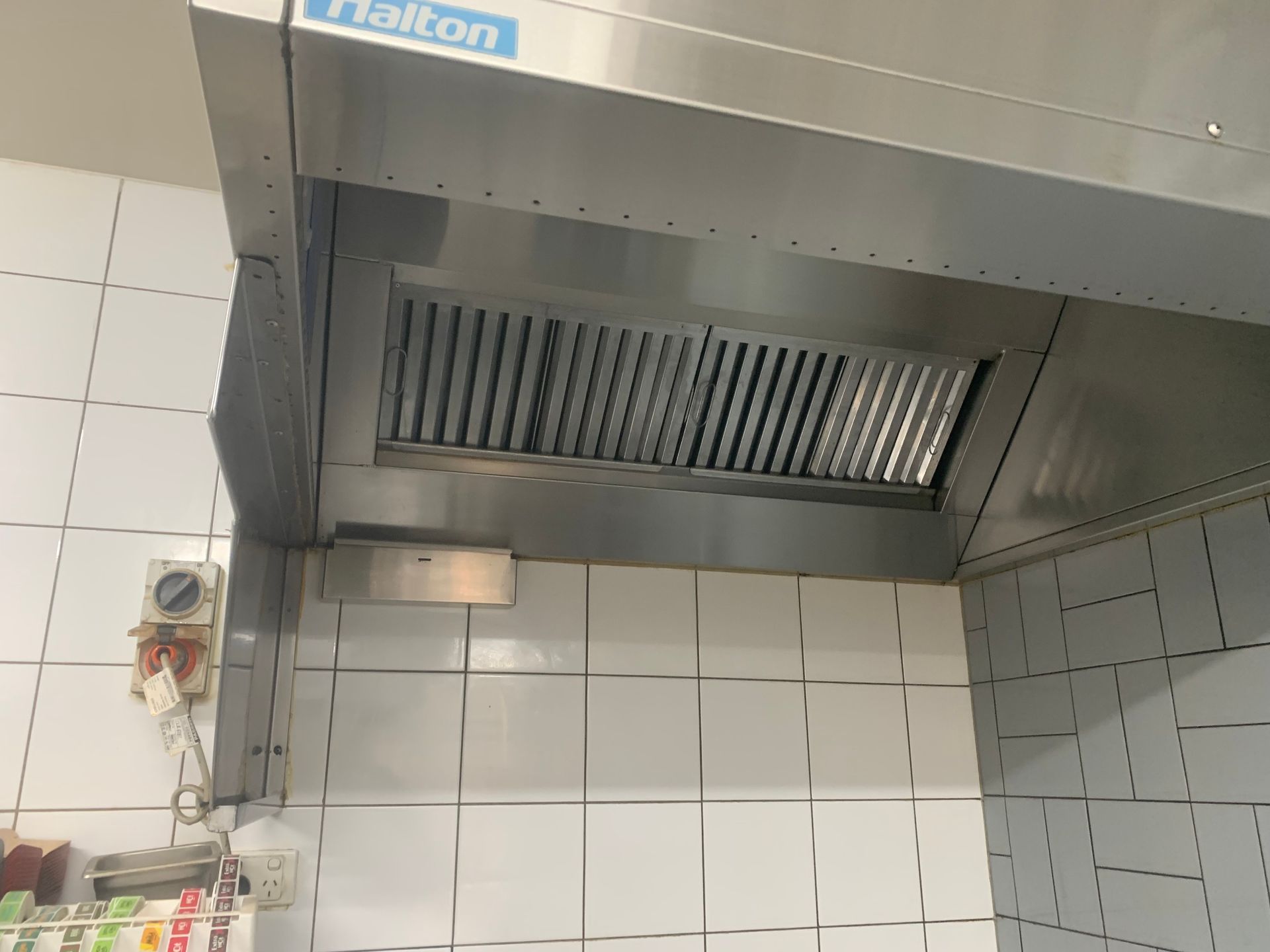 A kitchen with a lot of stainless steel appliances and sinks — DM & MM Services Pty Ltd in Ayr, QLD