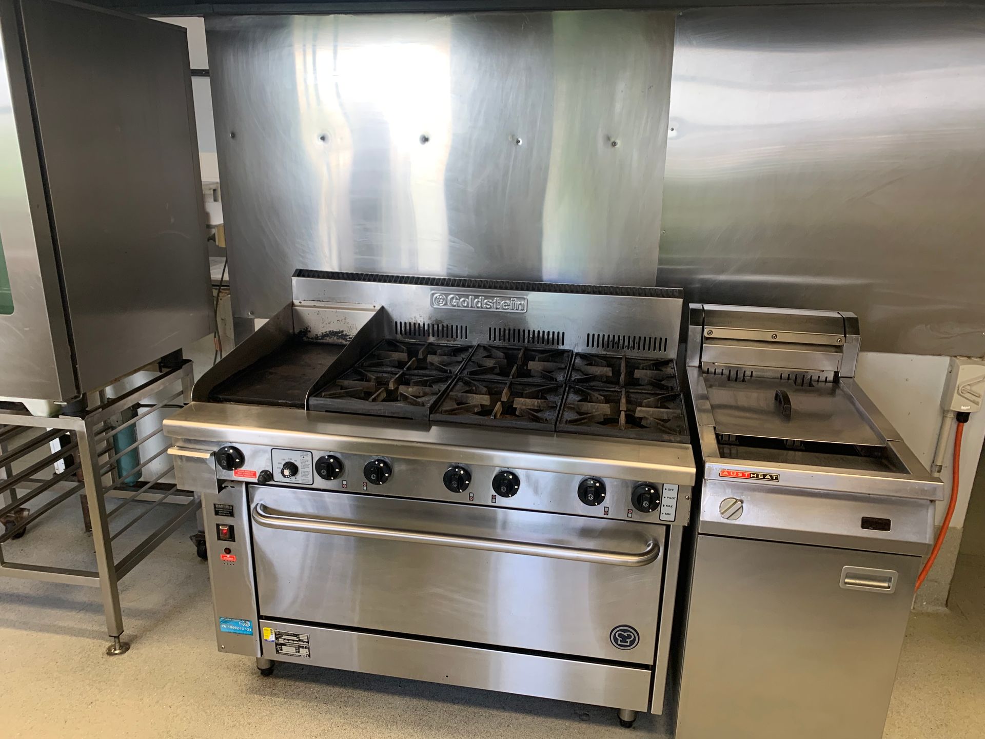 An Artist 's Impression Of A Large Commercial Kitchen With A Checkered Floor — DM & MM Services Pty Ltd in Ayr, QLD