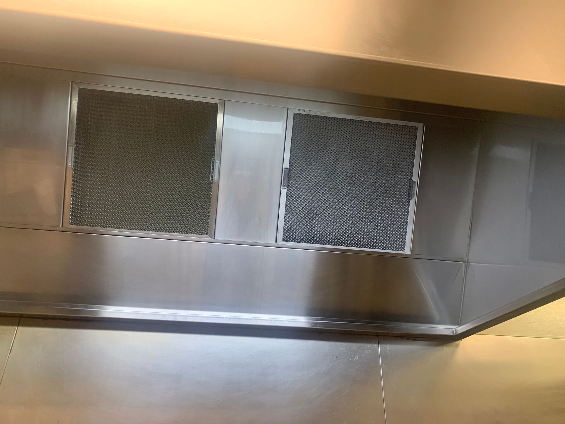 A Large Commercial Kitchen With Lots Of Stainless Steel Appliances — DM & MM Services Pty Ltd in Ayr, QLD