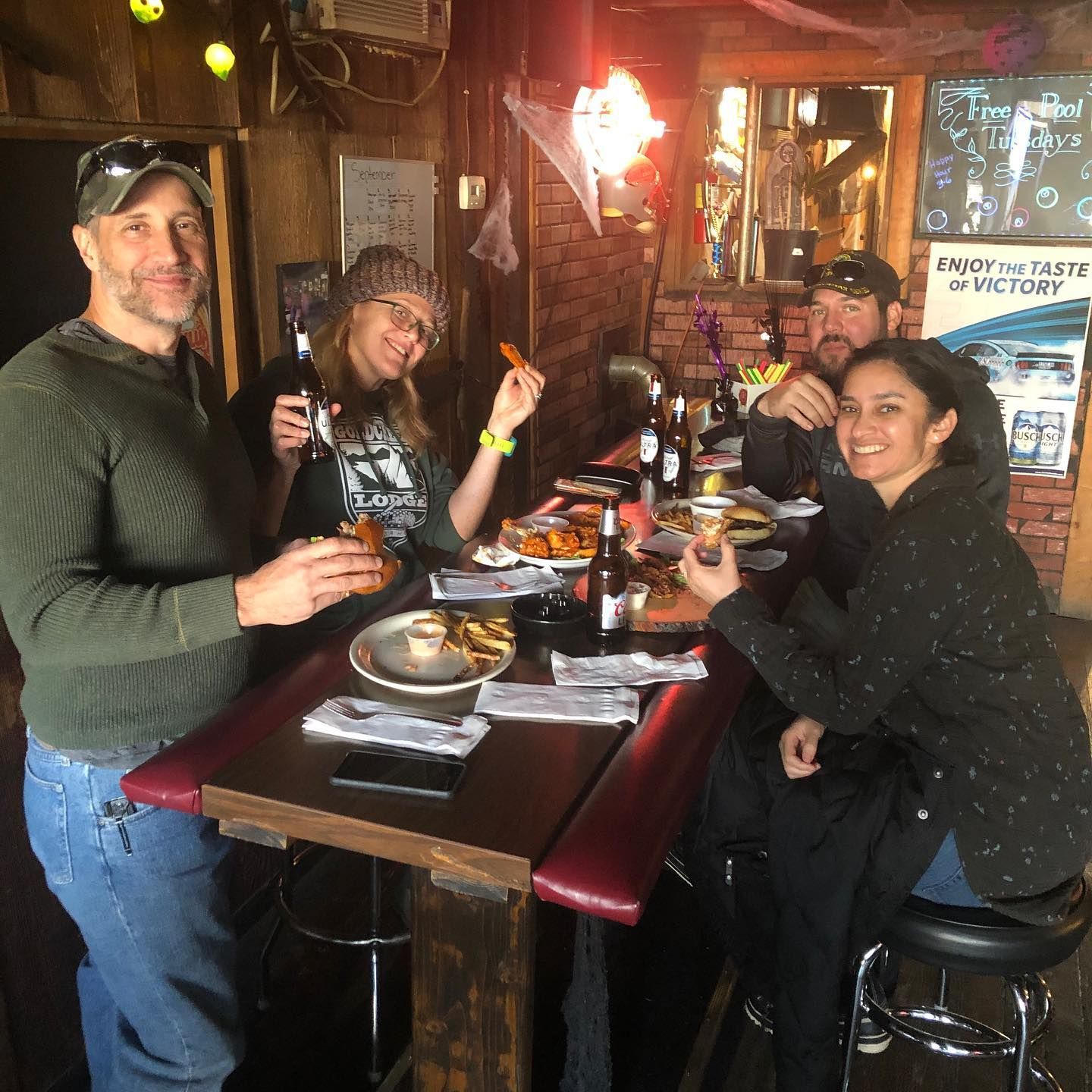 A group of people are sitting at a table in a restaurant