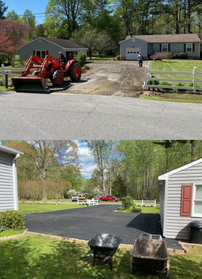 Person squeegeeing water from a puddle on asphalt road. Sunlit trees in background.