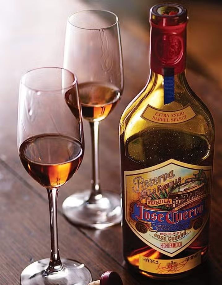 image of Jose Reserva extra anejo bottle with two glasses