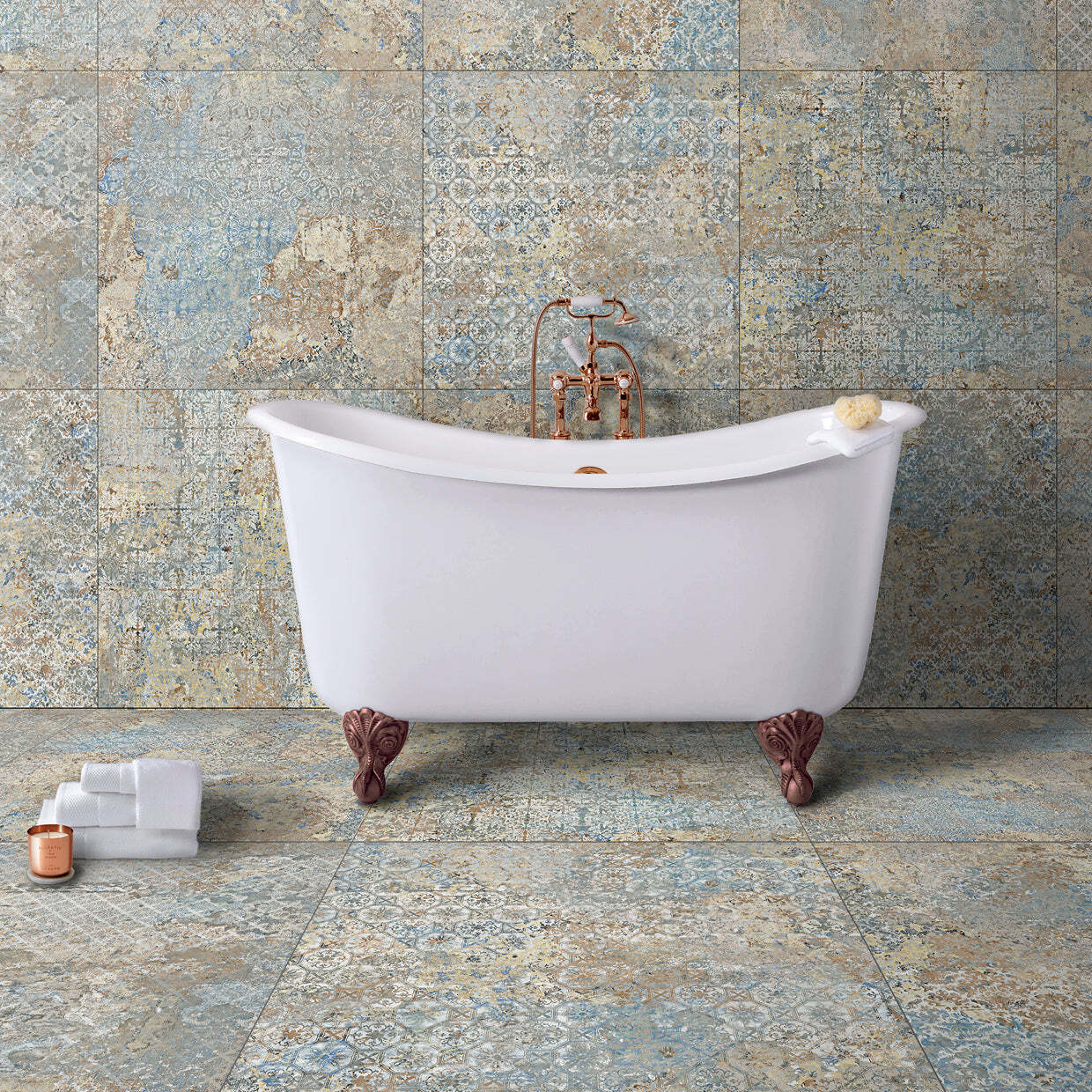 A white bathtub is sitting on a tiled floor in a bathroom.