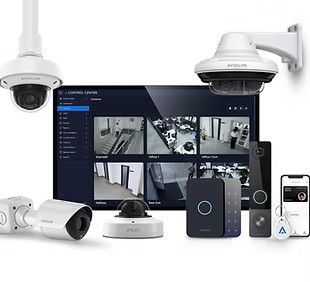 Security camera system: multiple cameras, monitor displaying live feeds, access control devices.
