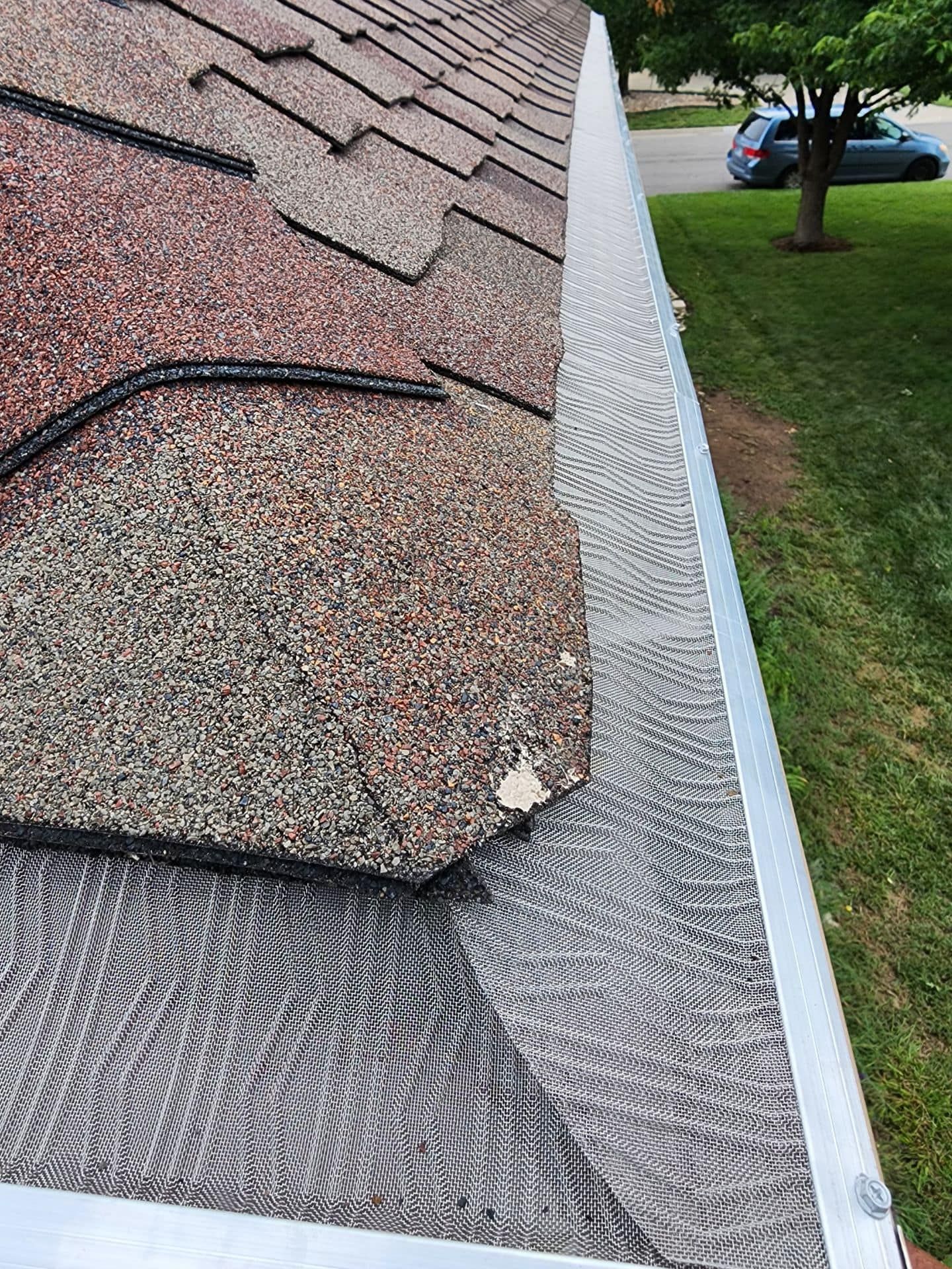 A close up of a gutter on a roof.