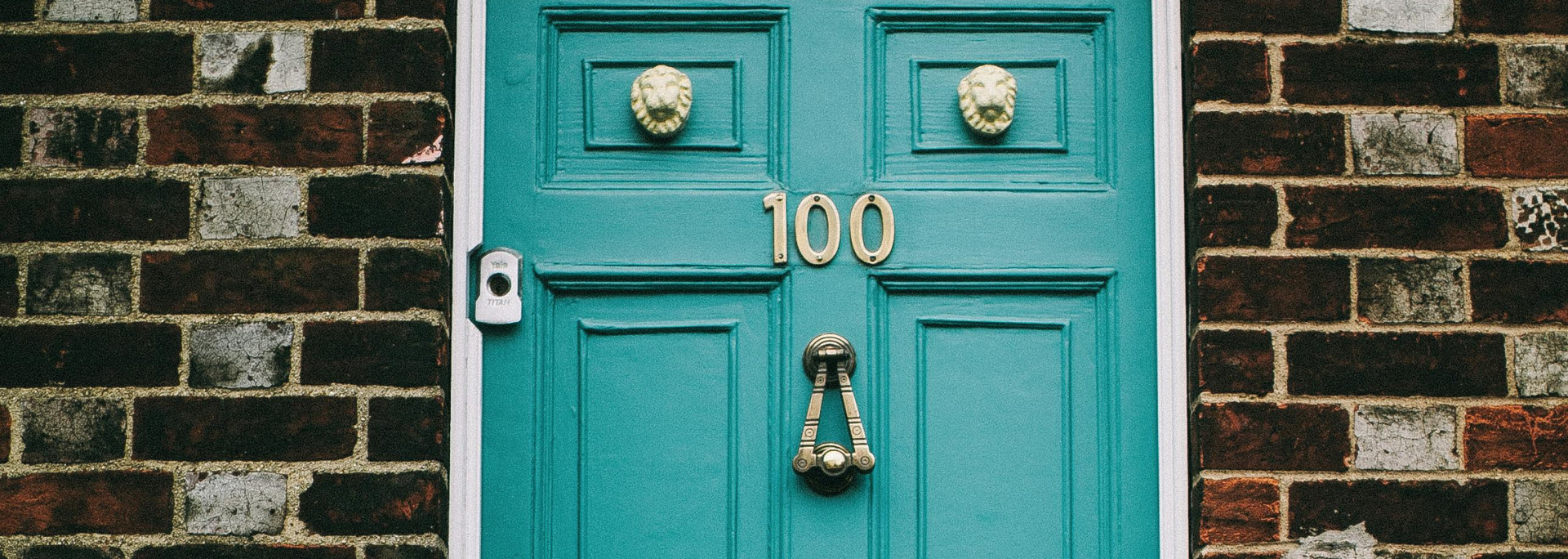 Picture of a front door with large lettering.