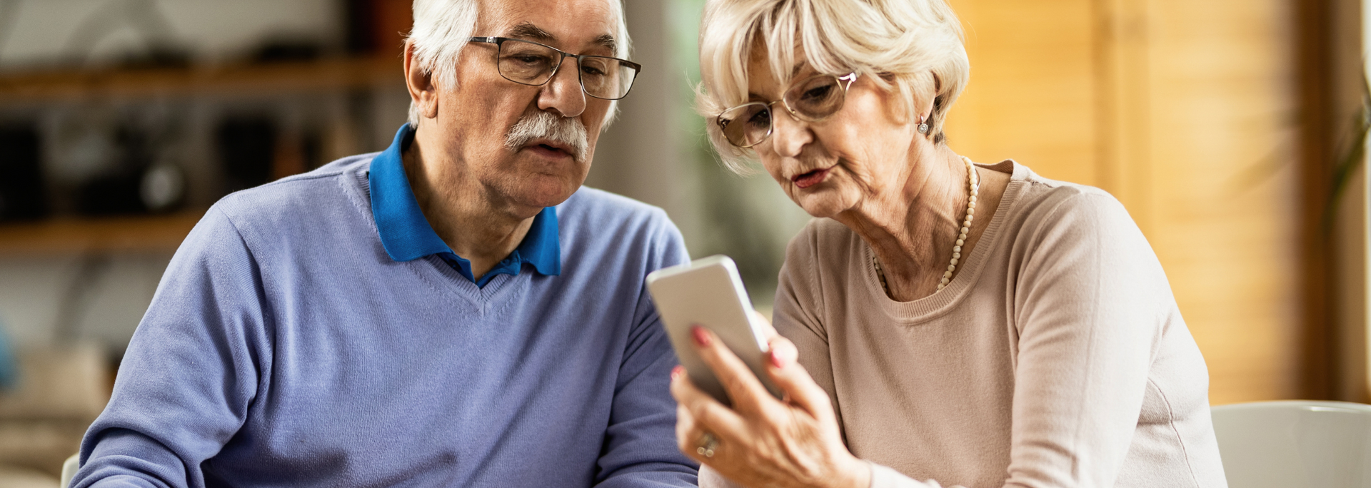 Picture of an older couple e.g. on the phone. Picture of an older couple e.g. on the phone.