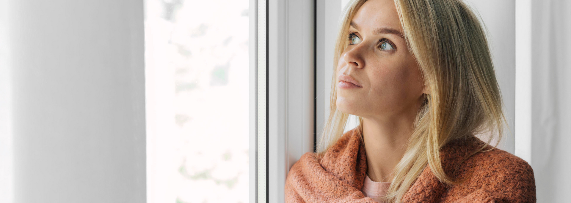 Picture of a person wrapped up warm but looking chilly, indoors. Picture of a person wrapped up warm but looking chilly, indoors.