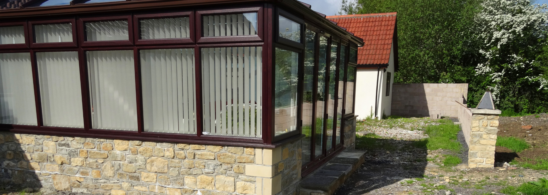 Picture of blinds in a conservatory.