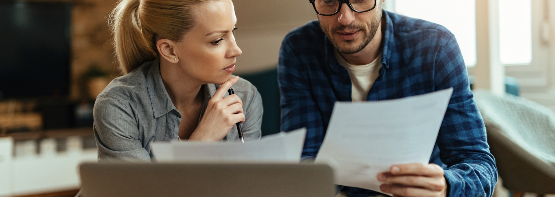 Picture of people looking through energy bills. Picture of people looking through energy bills.