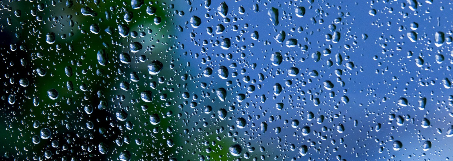 Picture of raindrops on a glass window pane.