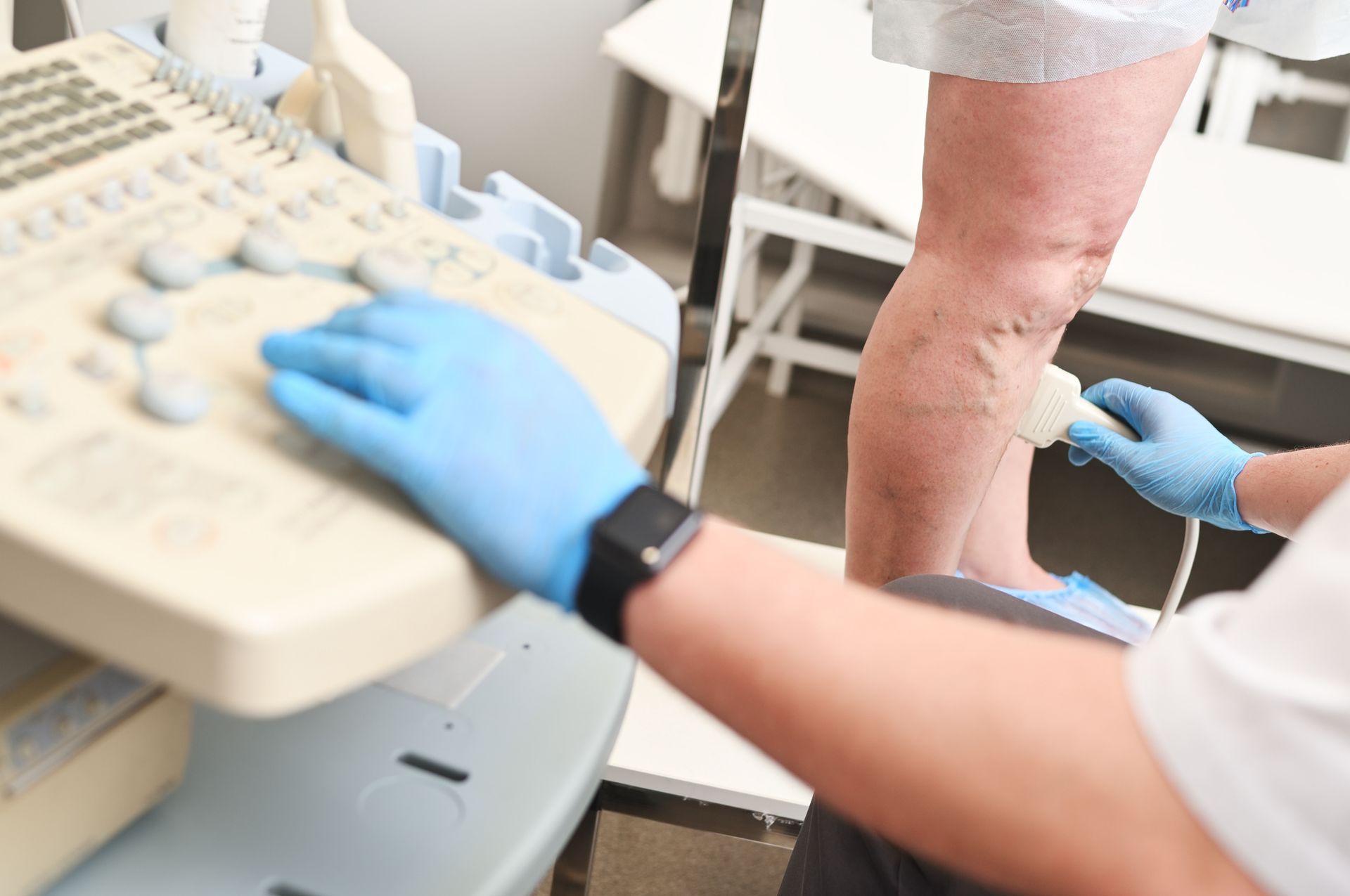 A phlebologist does an ultrasound of a patient with varicose veins. A phlebologist does an ultrasound of a patient with varicose veins.