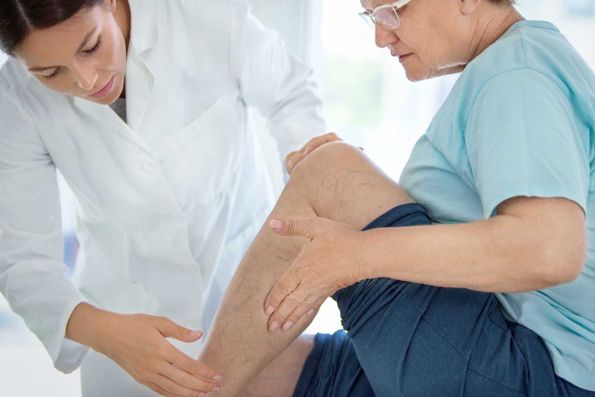 Medical inspection of varicose veins.
