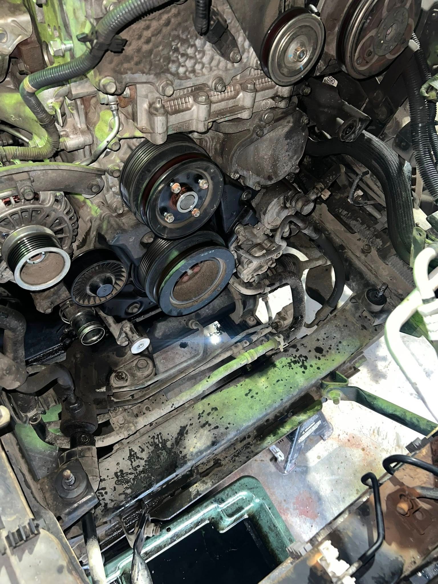 Dirty Car Engine With Multiple Pulleys and Belts — North Coast Heavy Diesel In Taree, NSWv