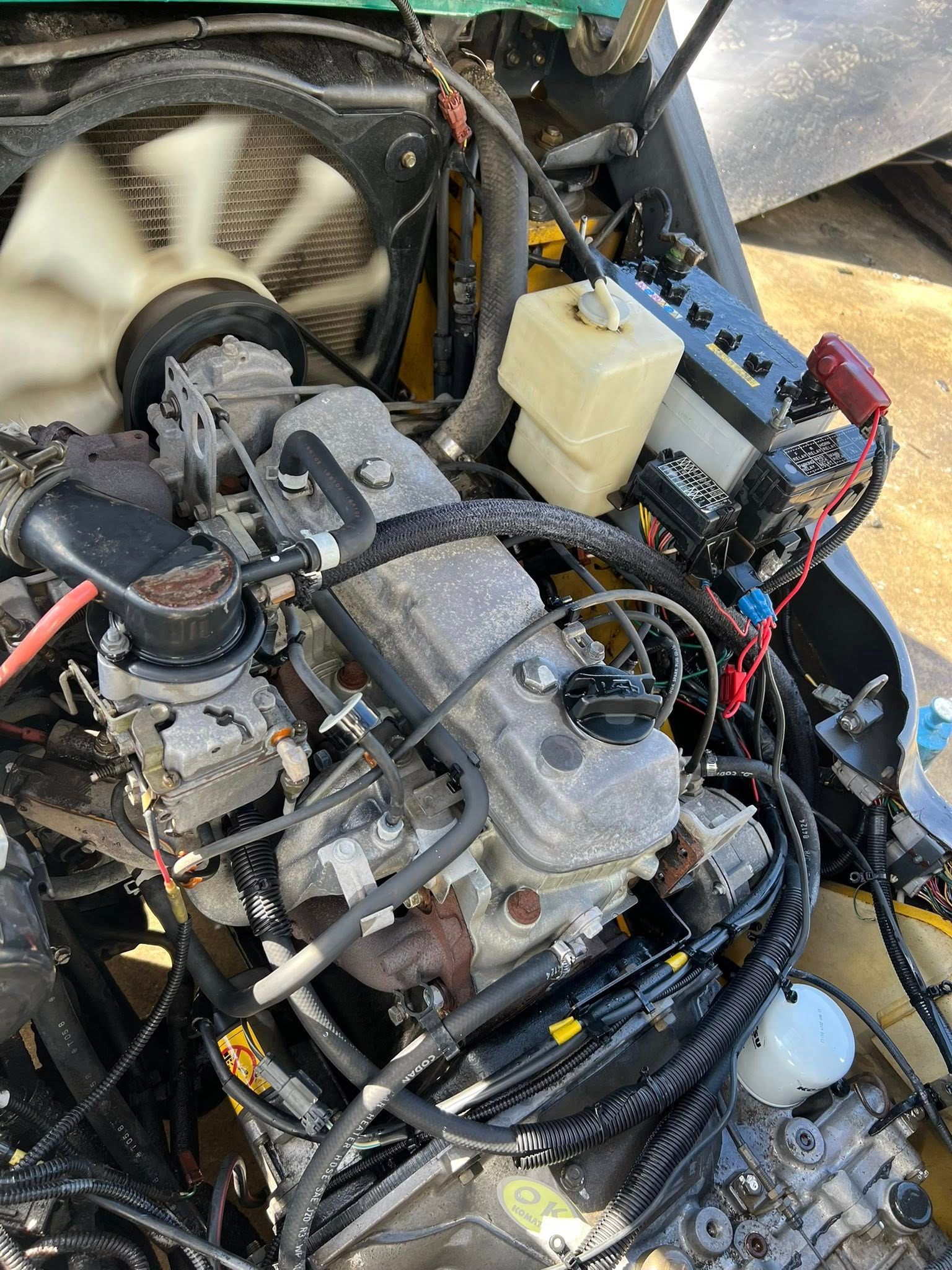 Engine Bay With a Gray Engine Block, Fan, and Various Components — North Coast Heavy Diesel In Thrumster, NSW