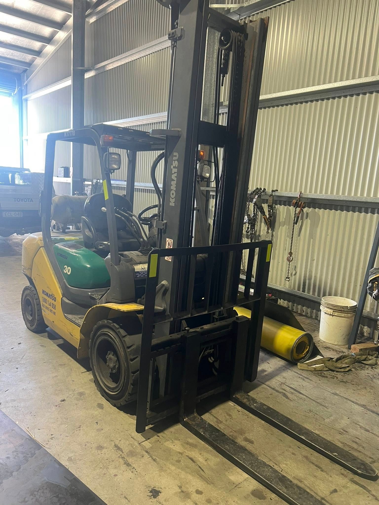 Yellow Forklift in a Metal-walled Warehouse, With Forks Lowered — North Coast Heavy Diesel In Taree, NSW