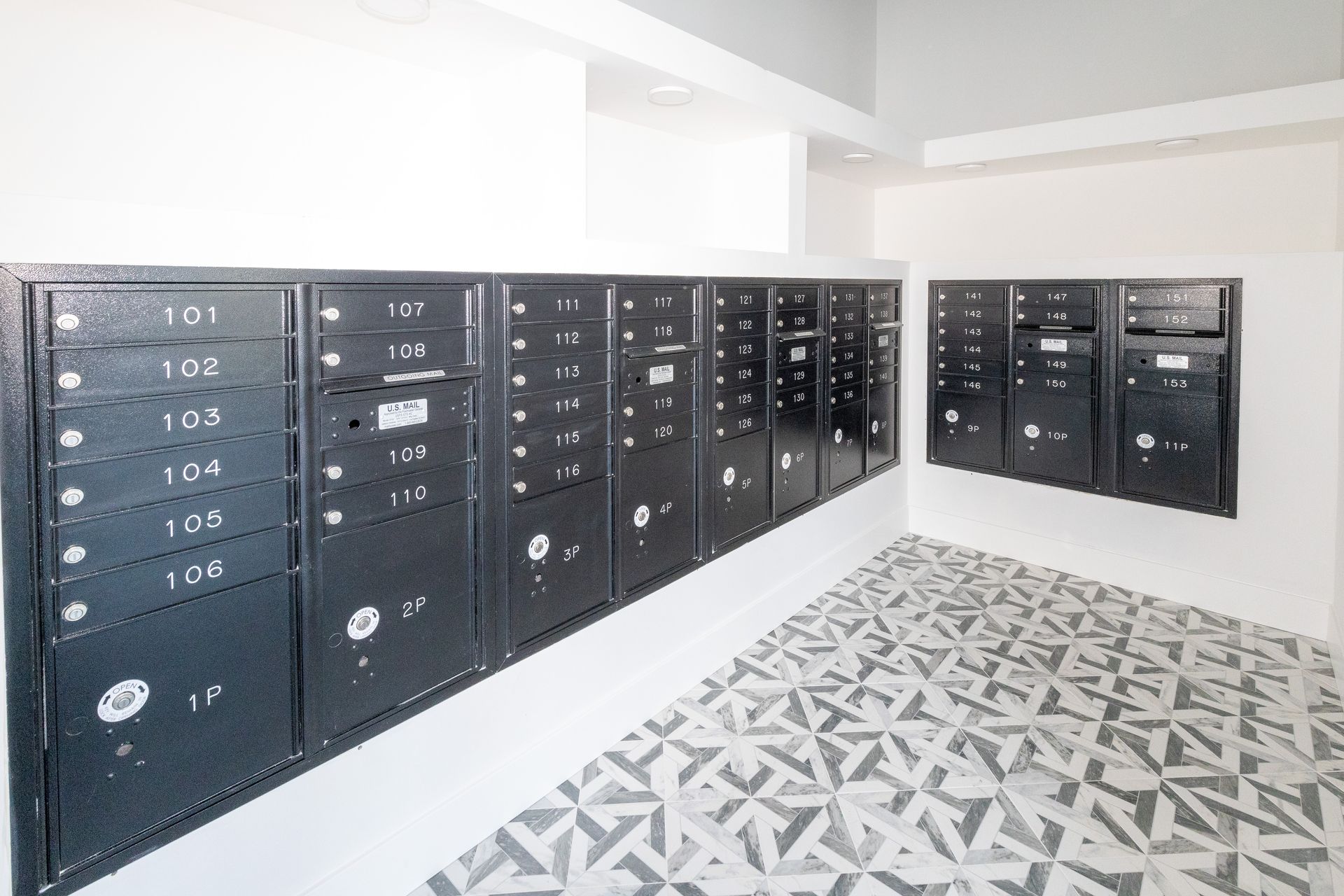 A room with a lot of mailboxes on the wall