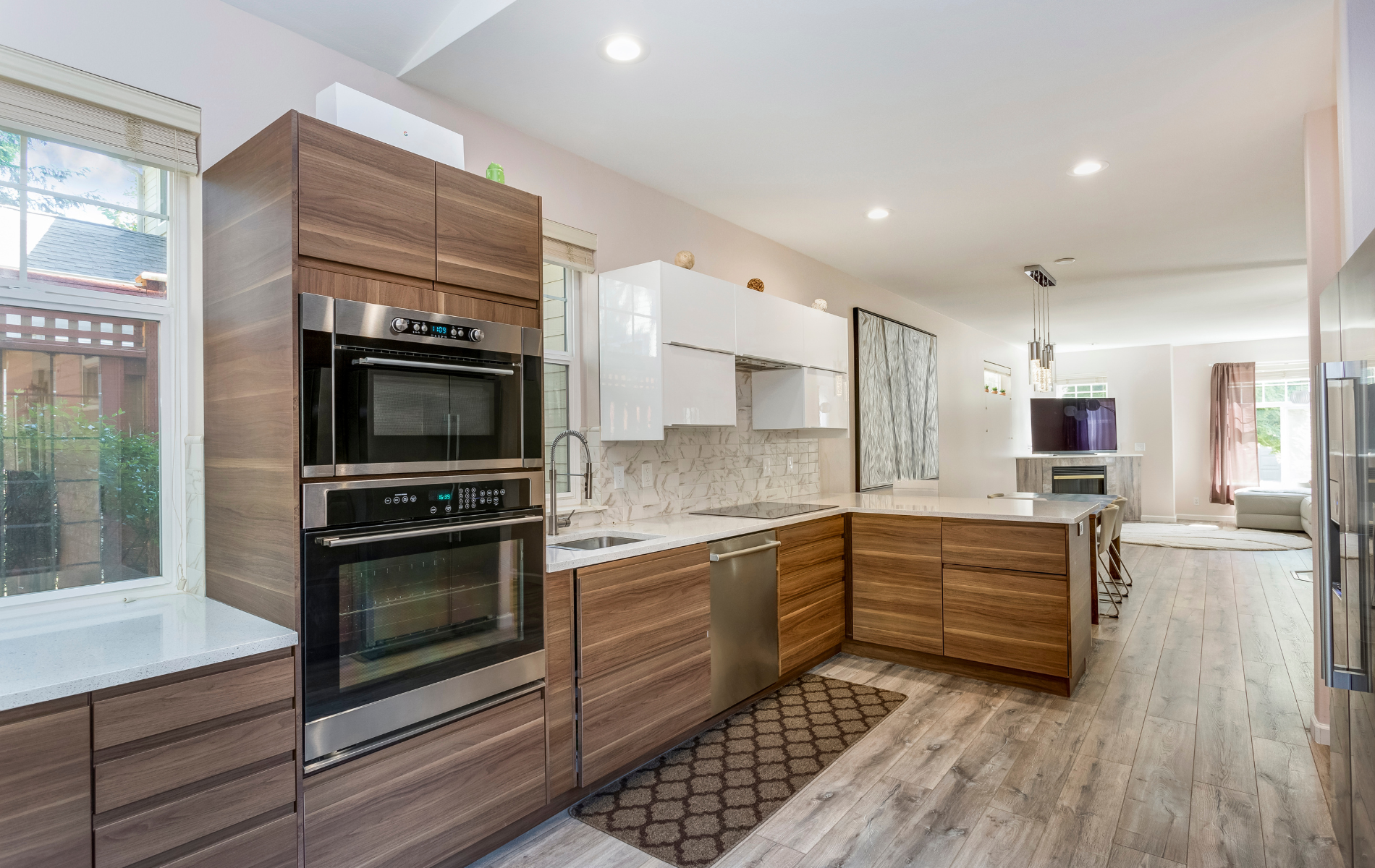 A kitchen with wooden cabinets and stainless steel appliances.