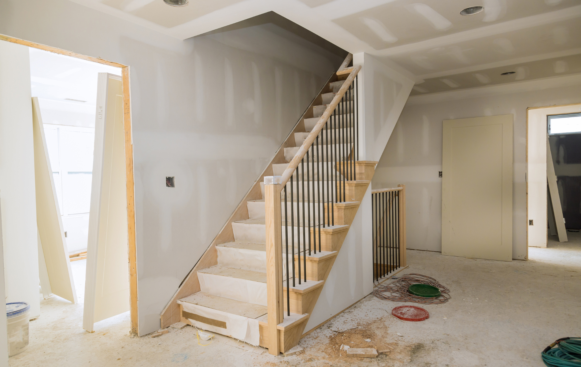 A staircase is being built in a house under construction.