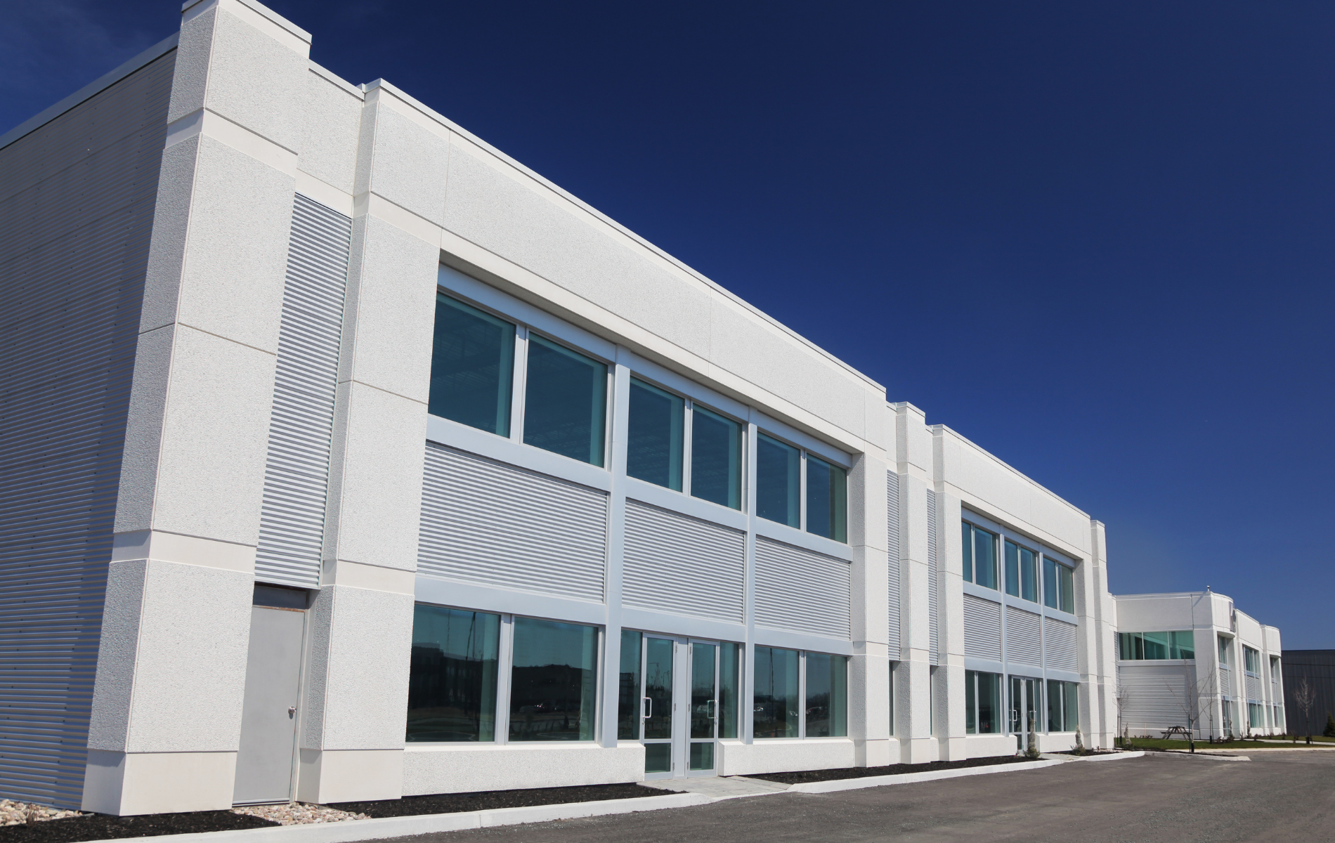 A large white building with lots of windows and doors