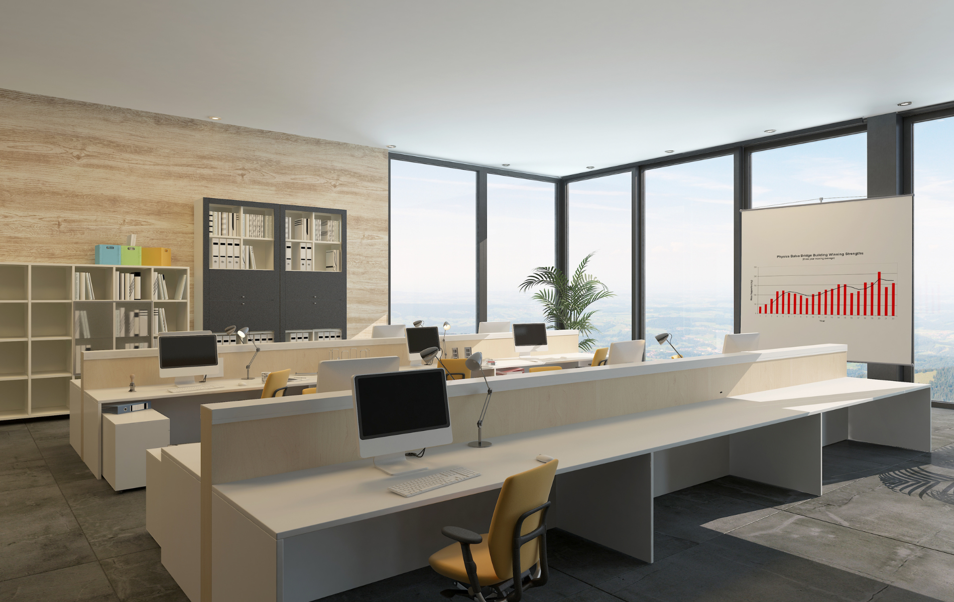 An empty office with a lot of windows and a large desk with a computer on it.