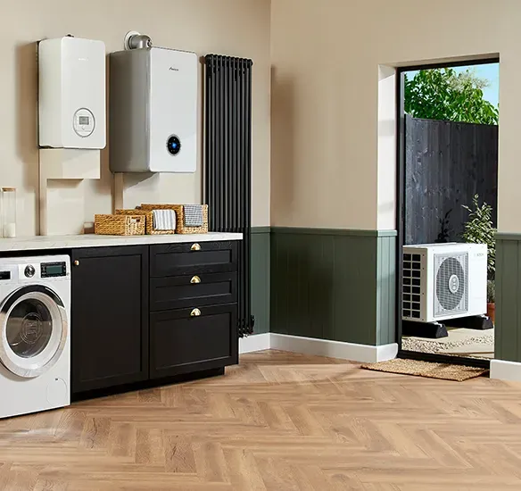 A group of five men in navy shirts posing. Indoor setting with blue wall, serious expressions.