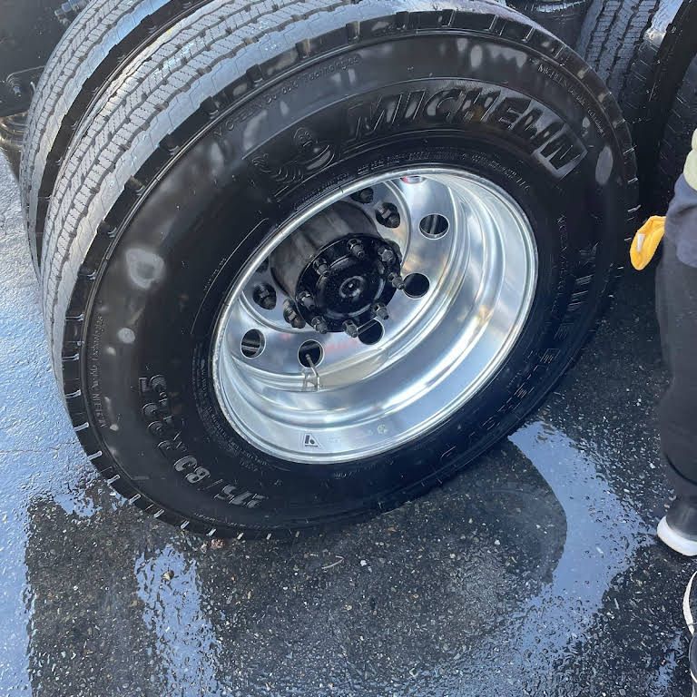 a close up of a michelin tire on a truck