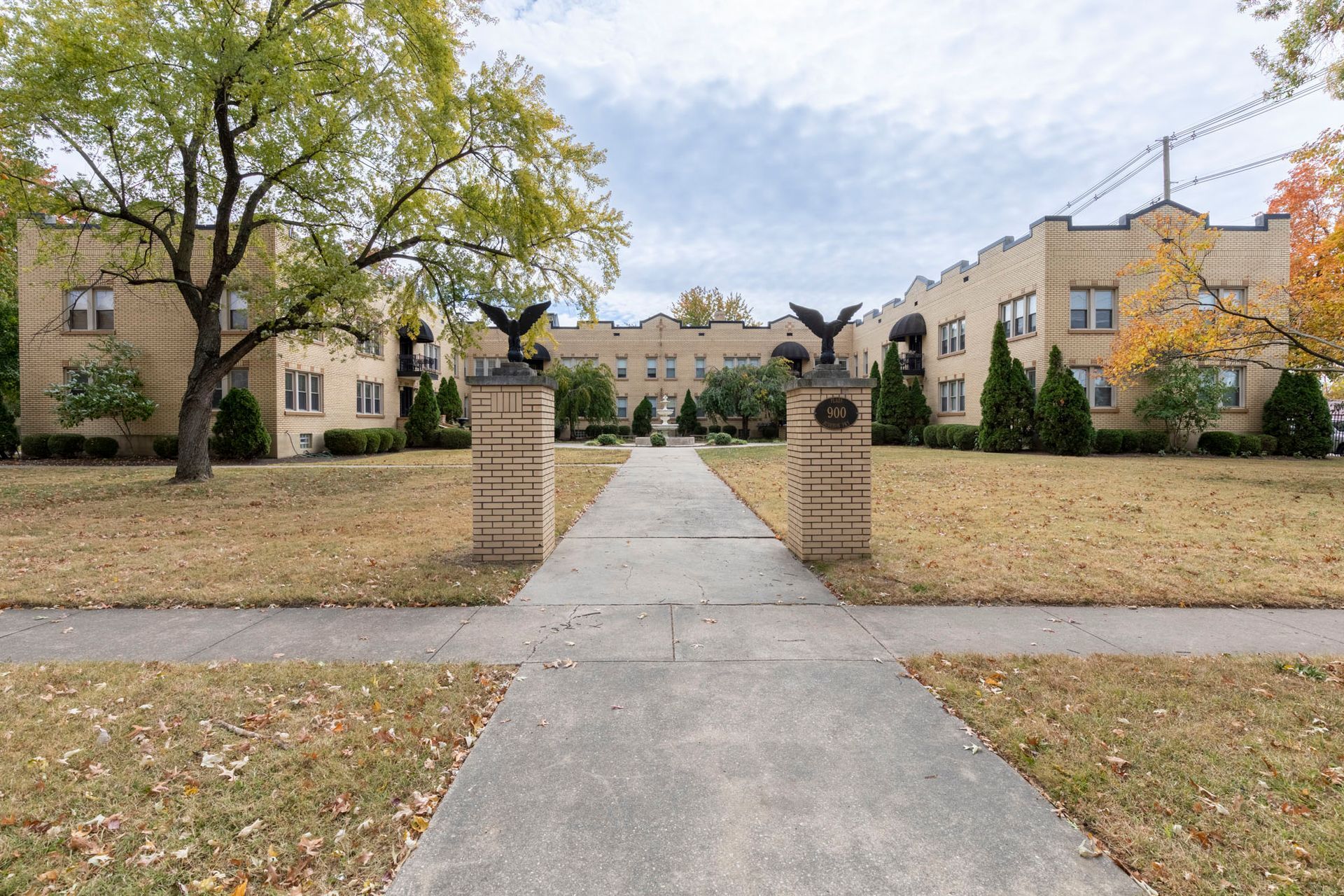 A large building with a statue of an eagle in front of it.