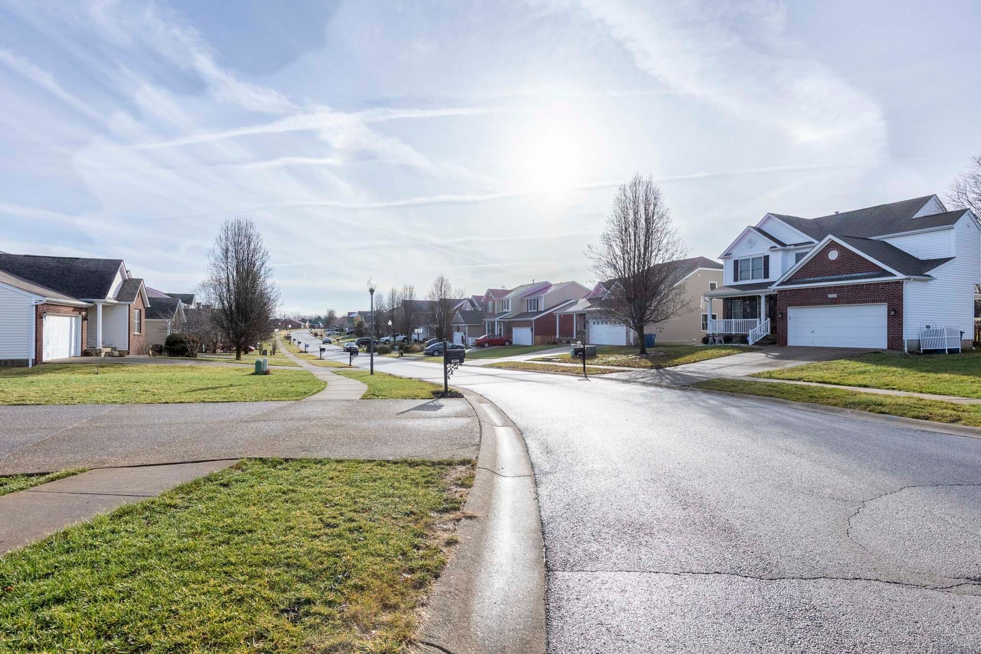 a row of houses on a residential street in a residential neighborhood .