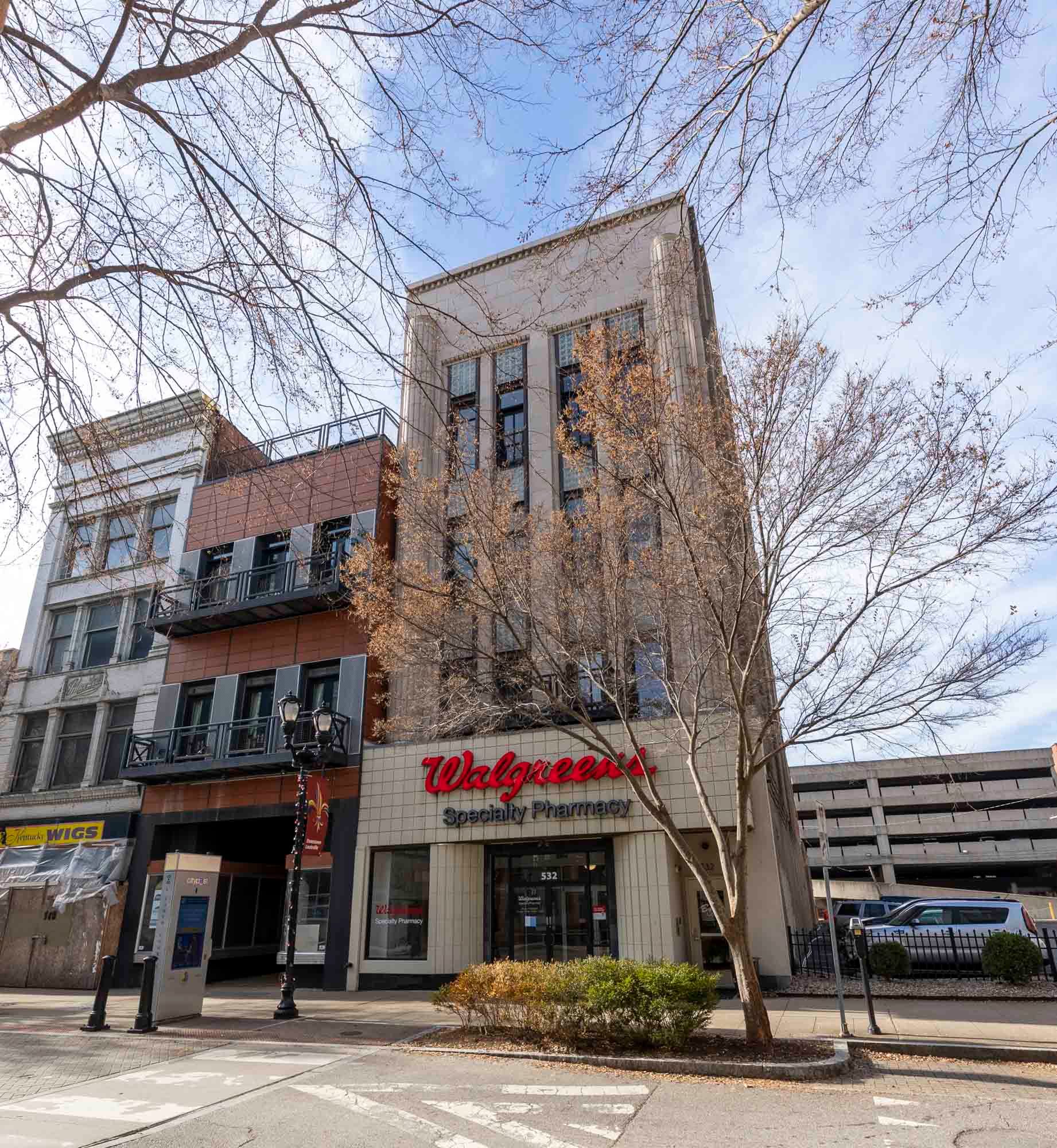 a large building with a walgreens store in the middle of it .