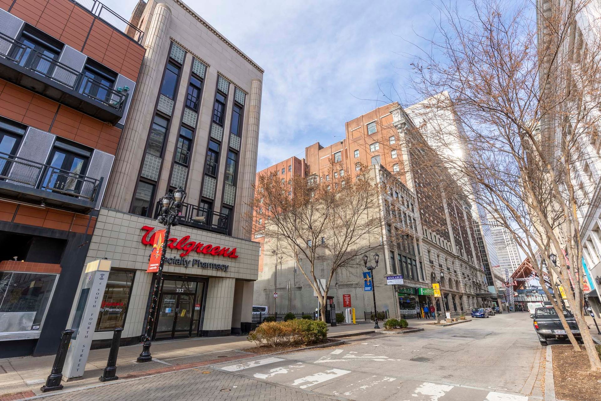 a walgreens store is located in the middle of a city street .