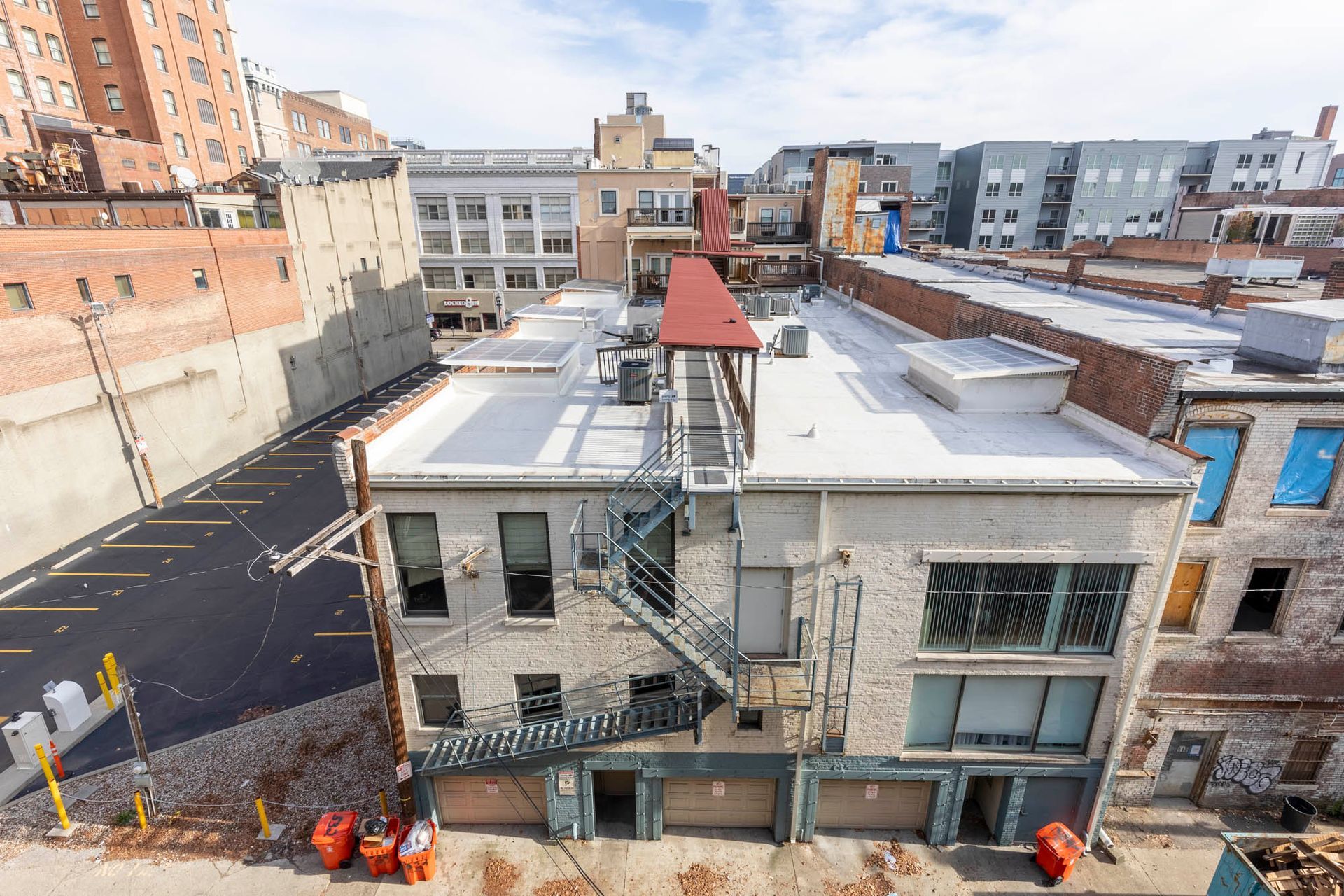 an aerial view of a building with a fire escape on the roof