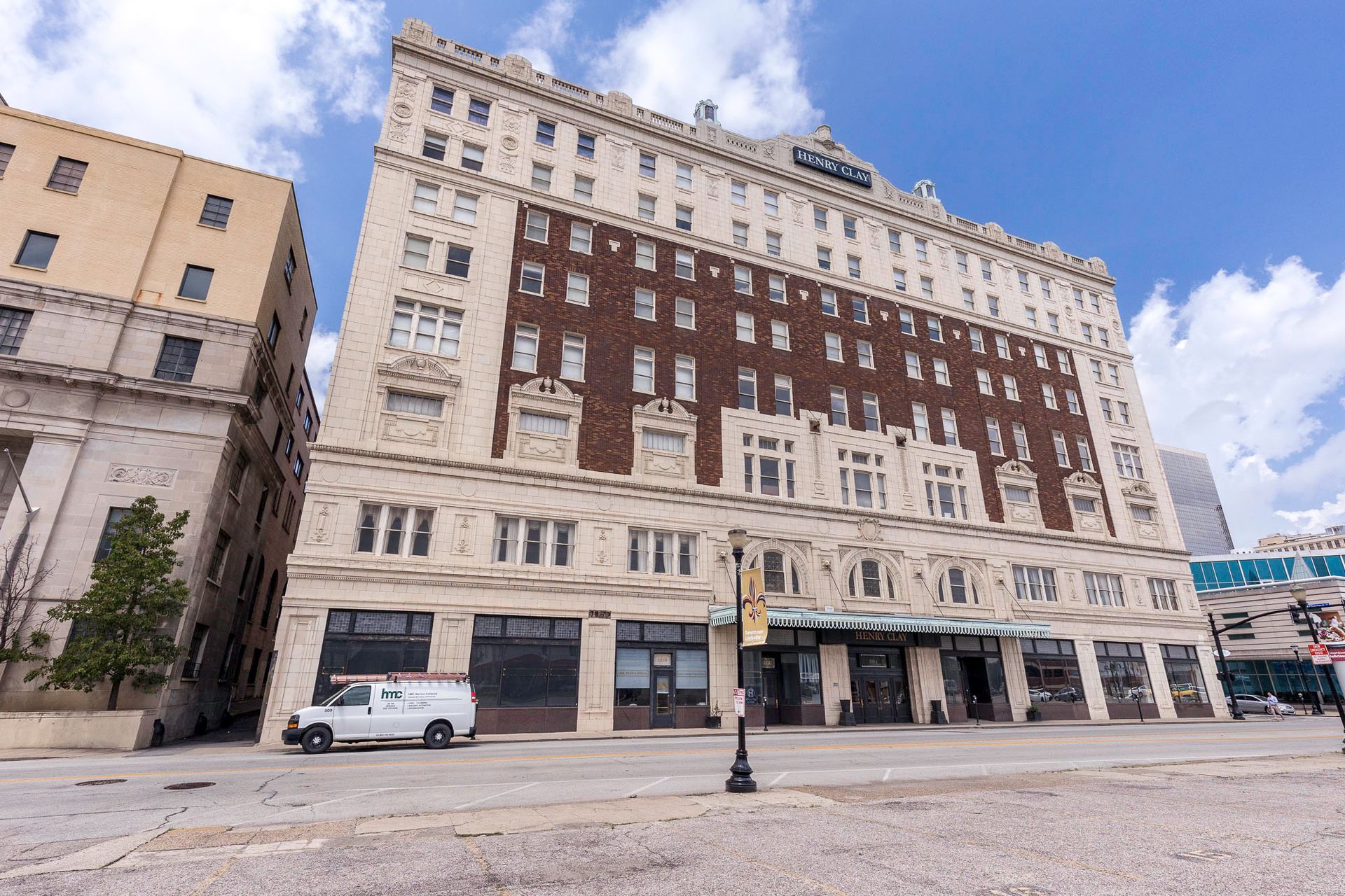 A large building with a white van parked in front of it.
