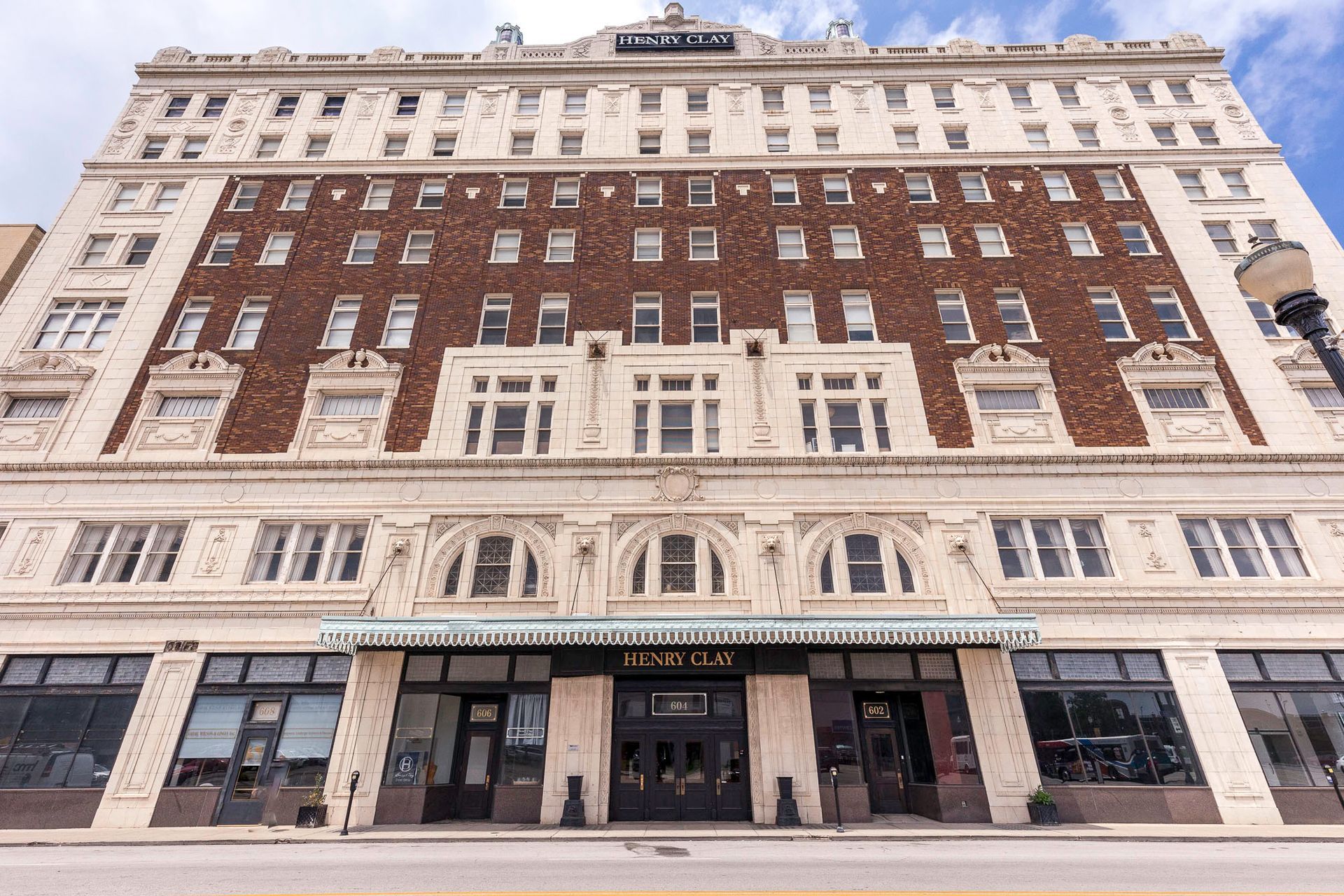 A large building with a lot of windows and a street light in front of it